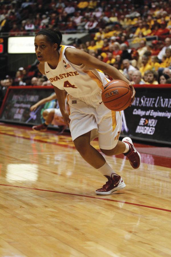 Guard Nikki Moody attacks the Aggie defense as she brings the
ball up the court. Moody put up five points and four assists in the
Cyclones 59-33 loss to Texas A&M on Saturday, Jan. 14, at
Hilton Coliseum.
