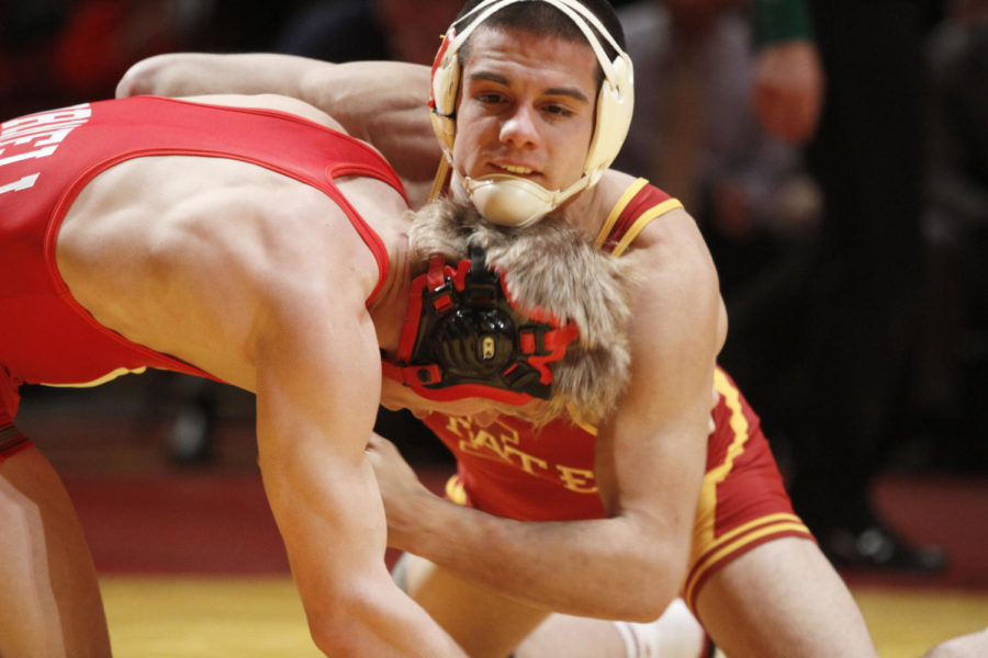 Michael Moreno fights to take control of his opponent Kyle Dake
in the Iowa State vs Cornell meet on Sunday, Jan. 29. Moreno lost
to Dake 6-1 in the 157 weight class.
