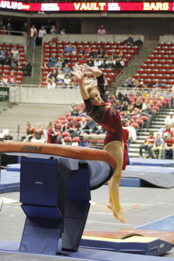 All-around gymnast Celine Paulus vaults for a score of 9.675
during the opening meeting against Nebraska on Friday, Jan. 20, at
Hilton Coliseum. Paulus finished the night by leading the team with
a 39.150 all-around score.
