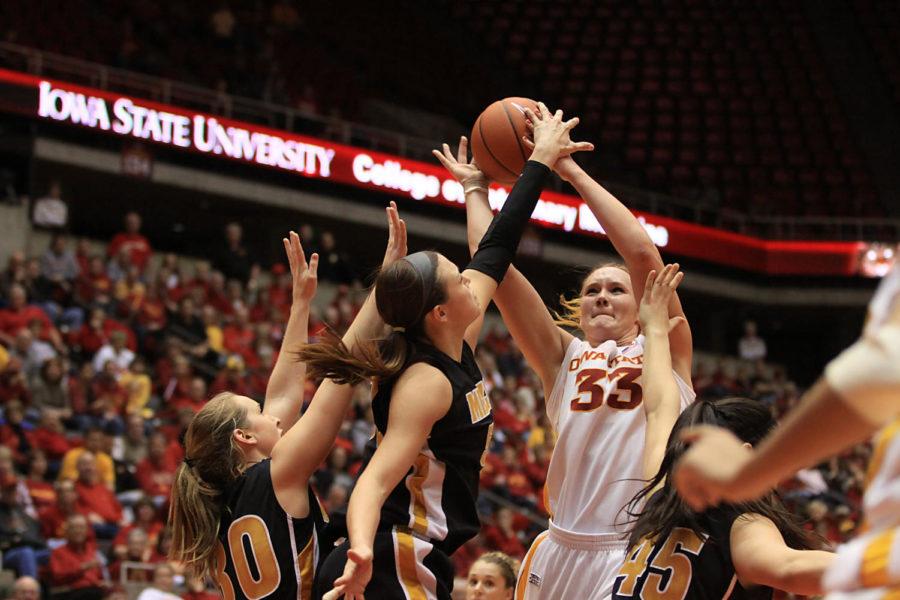 Junior forward Chelsea Poppens is fouled as she goes up for a
shot against Missouri on Tuesday, Feb. 21, at Hilton Coliseum. With
her 13th double-double of the season, Poppens has racked up 949
career points at Iowa State.
