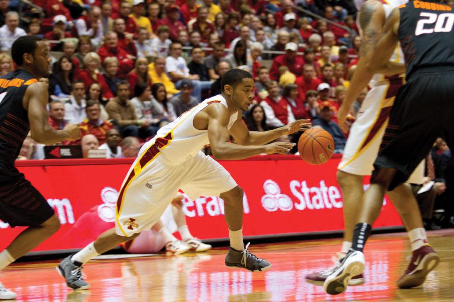 ISU guard Chris Allen runs past an Oklahoma State player. Iowa
State faced Oklahoma State for the second time at Hilton on Jan.
18, winning with a last minute 3-pointer by Scott Christopherson.
The final score was 71-68.

