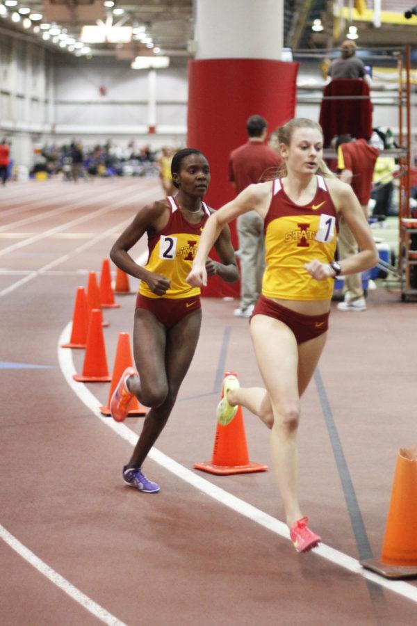 Betsy Saina, left, and Dani Stack compete in the 1-mile run in the ISU Open Track and Field on Saturday, Jan. 21, at Lied Recreation Athletic Center. Saina finished first in the fastest heat with a time of 4:44, followed closely by Stack with a time of 4:46. 
