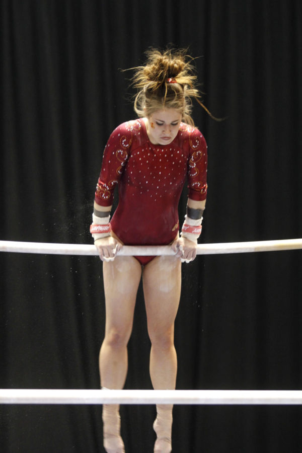 Megan McDonald starts off on the top bar for the uneven parallel
bars event during the meet against Iowa on Friday, Jan. 27.
McDonald recieved a 9.750 to help the Cyclones defeat the Hawkeys
194.900-194.550. 
