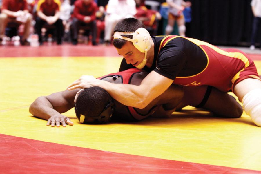 ISU wrestler Boaz Beard competes in the 184 weight class against
Wisconsin wrestler Timmy McCall. McCall fell to Beard by decision
with a final score of 7-2. The Iowa State wresting team held the
Iowa State Regional on Sunday. The team matched up against the
Wisconsin Badgers and won with a final team score of 33-3. 
