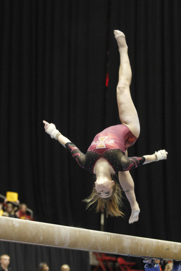Caitlin Brown performs her routine on the beam in the meet
against Nebraska on Friday, Jan. 20. She ended the event with a
score of 9.775.
