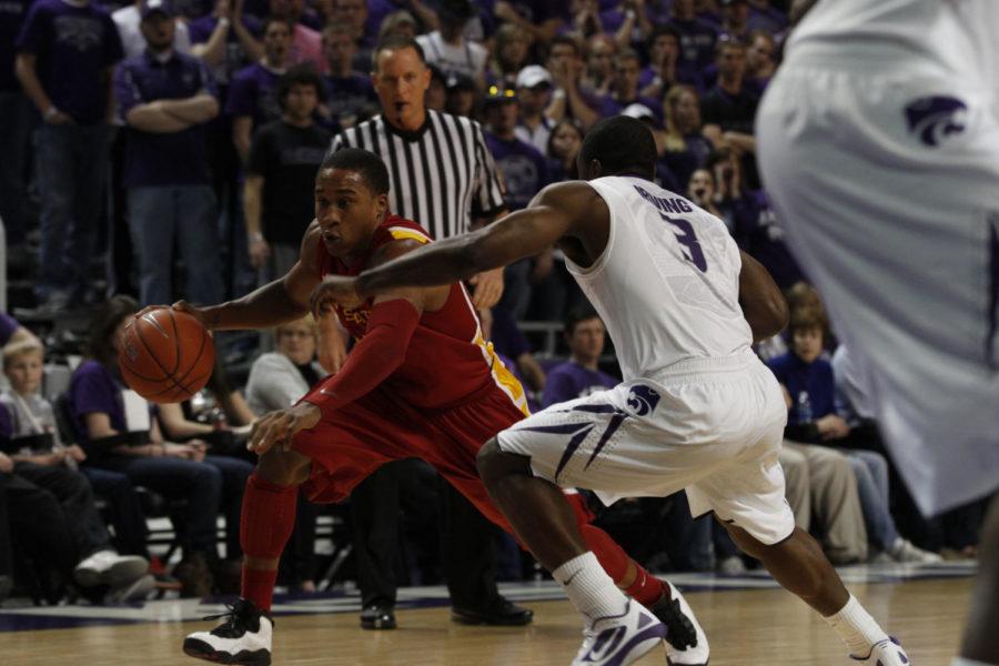 ISU guard Tyrus McGee drives past Kansas State guard Martavious Irving in the first half of Iowa States 65-61 win over the Wildcats on Saturday, Feb. 25. McGee led the Cyclones off the bench with six points.
