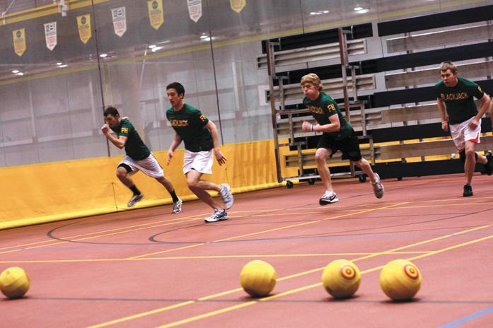 Team Blackjack races toward center court to be the first to grab a ball and knock out an opponent. Colleges Against Cancer hosted a dodgeball tournament at Lied Recreation Athletic Center on Sunday.