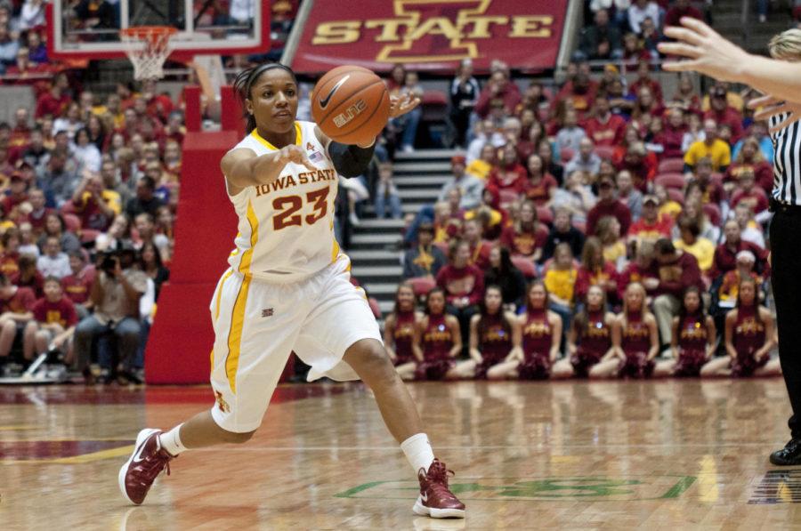 Cyclone guard Chassidy Cole passes the ball to her teammate
during the game against Baylor on Saturday, Jan. 7, at Hilton
Coliseum. The top-ranked Bears won the game 57-45.
