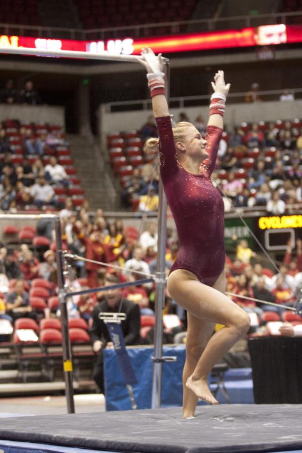 Celine Paulus executes a stuck landing after her performance on
the uneven bars during the meet Friday, Jan. 27, at Hilton
Coliseum. Paulus received a 9.850 to help the Cyclones defeat the
Hawkeyes 194.900-194.550. 
