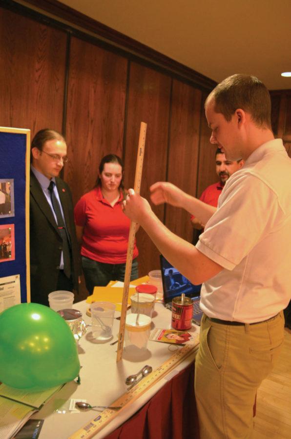 Peter Huffman, Eli Young and Laura Lutz, all graduate students
in materials engineering, demonstrate their interactive booth
during Dan Schectman's reception. Schectman was recieved by
chemisty and materials engineering students Tuesday, Feb. 14, in
the Oak Room of Memorial Hall.
 
