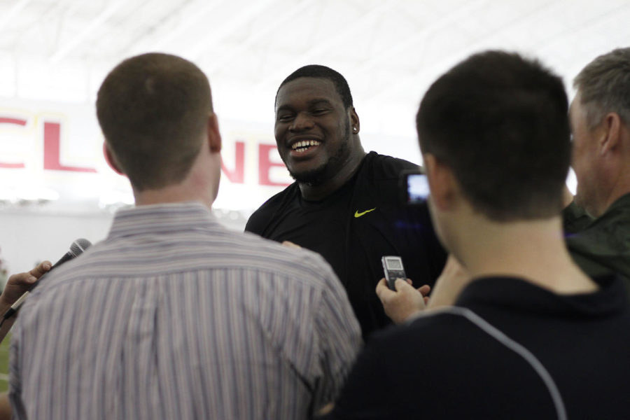 Former ISU offensive tackle Kelechi Osemele talks with the press at Cyclone Football Pro Day on Tuesday, March 20, at the Bergstrom Indoor Practice Facility.
