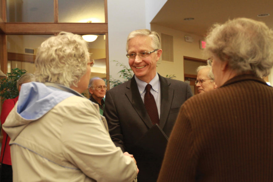 Chief Justice Mark S. Cady greets people before his speech on Thursday, March 22, at Northminster Presbyterian Church in Ames. Cadys speech covered how Iowas judicial selection and retention system works, changes that could be proposed over the years and how they will effect on our justice system. Cady also answered questions from the audience after his speech. 
