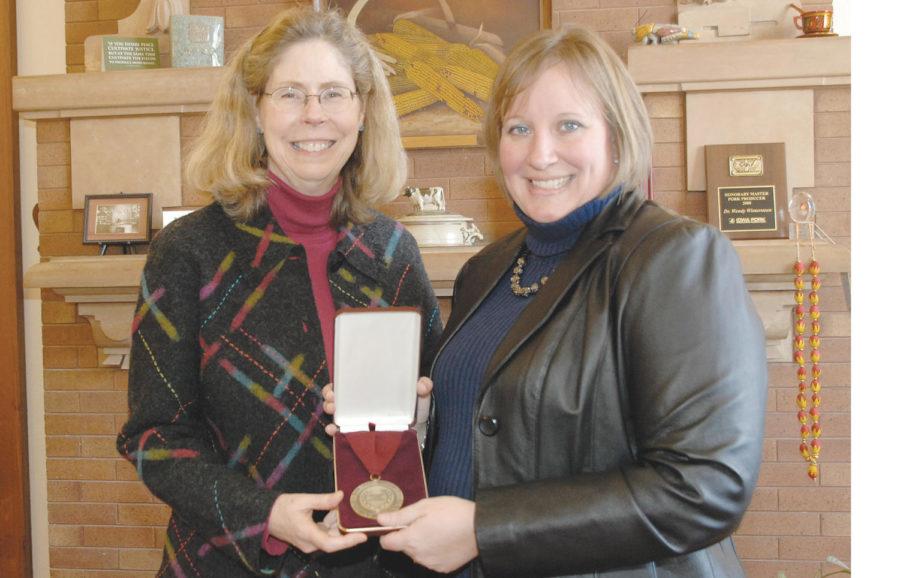 Jodi Sterle, right, was named the 2012 recipient of the Eldred and Donna Harman Professorship in Excellence in Teaching and Learning for the department of animal science.
