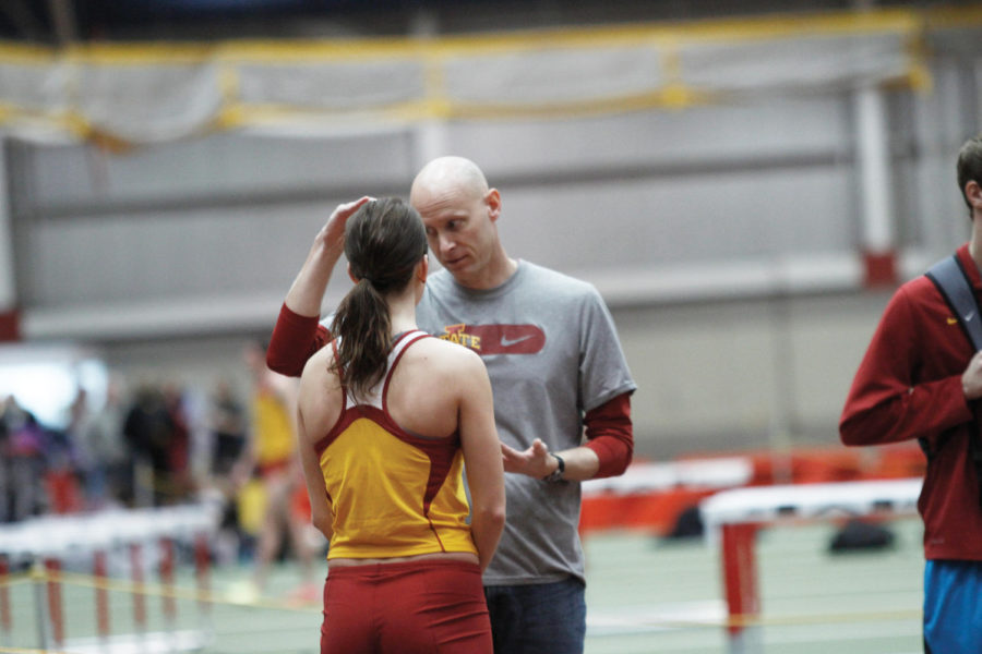 Assistant+coach+Pete+Herber+gives+high+jumper+Kelly+McCoy+pointers+between+her+jumps%C2%A0during+the+NCAA+Qualifier+track+meet%C2%A0at+Lied+Recreation+Athletic+Center%C2%A0on+Saturday%2C+March+3.+McCoy+placed+second+in+the+high+jump+with+a+final+height+of+1.64+meters.%0A