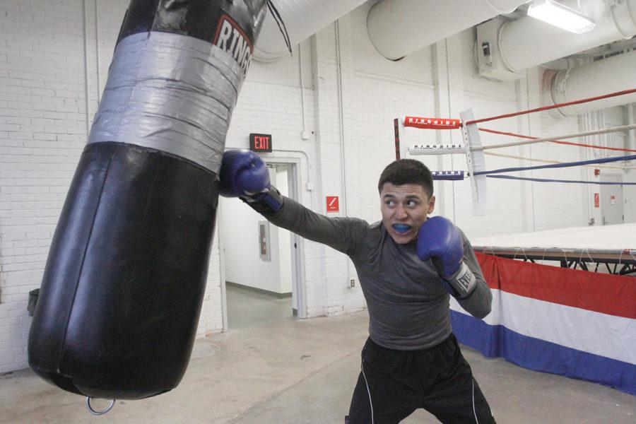 Josue Avila, freshman in engineering, practices on the punching bag during boxing club practice at State Gym on Wednesday, March 21. Avila will be competing at 132 pounds in the NCBA National Championships on April 5 to 7.
