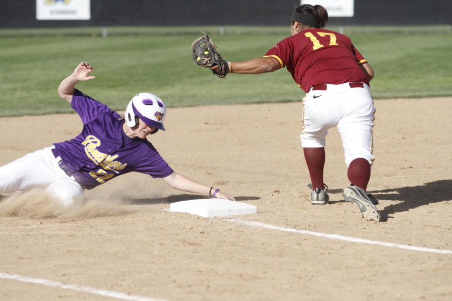 Senior third baseman Dalyn Varela attempts to tag out a sliding UNI batter during Tuesdays game at the Southwest Athletic Complex. Varela accounted for the Cyclones two hits against UNI pitcher Jaye Hutchenson.
