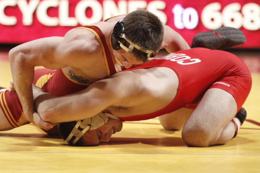 Andrew Sorenson works to keep Cornells Marshall Peppelman from
escaping on Sunday, Jan. 29, at Hilton. Sorenson defeated Peppelman
21-6 and the Cyclones ended the night with a 28-12 defeat to Big
Red.
