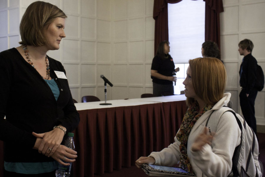 Kaylee Spencer, senior in kinesiology and health, gets advice from Katie Pearce, admission coordinator at Des Moines University, during the Professional School Fair on Tuesday, March 27, in the Cardinal Room of the Memorial Union.
