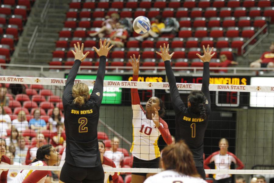 Outside hitter Victoria Hurtt jumps for a spike against Arizona
States Sonja Markanovich (left) and Nora Tuioti-Mariner during
Friday nights match Sept. 2 at Hilton Coliseum. Hurtt and Carly
Jeson tied for number of kills with 15 each to guide the Cyclones
to a 3-1 victory over the Sundevils.
