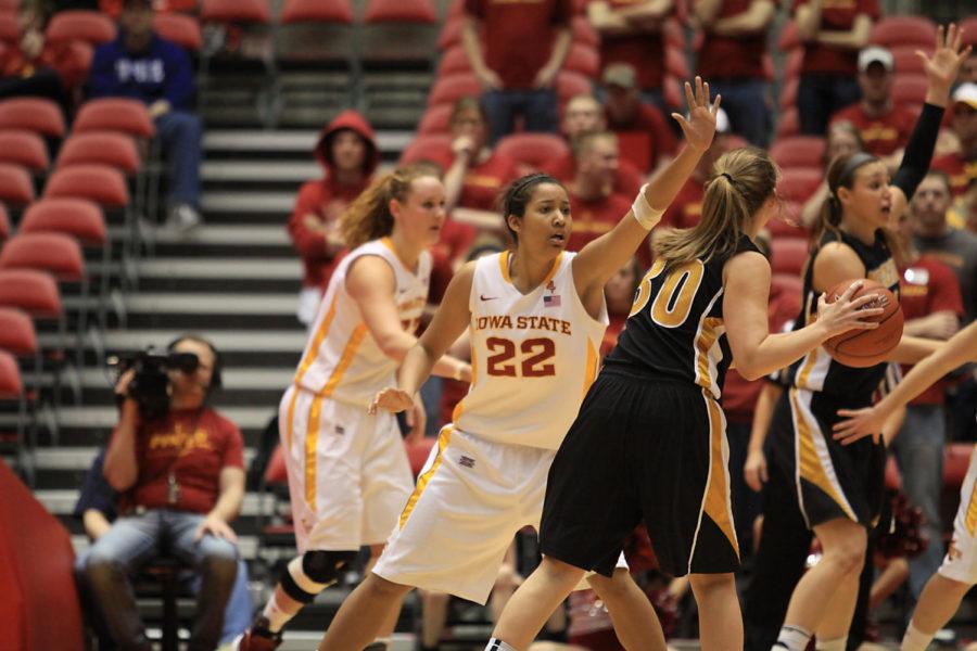 Freshman guard Brynn Williamson contests a Missouri
player Tuesday, Feb. 21, at Hilton Coliseum. Williamson added four
rebounds to the teams total of 48.

