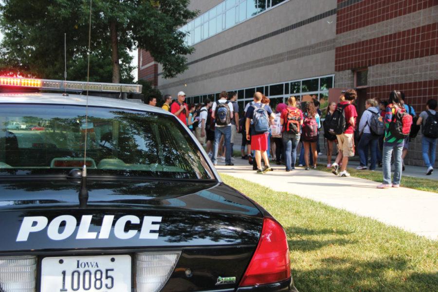 On Wednesday, Aug. 30, students wait outside the Molecular
Biology building as the police check out a pulled fire alarm.  
