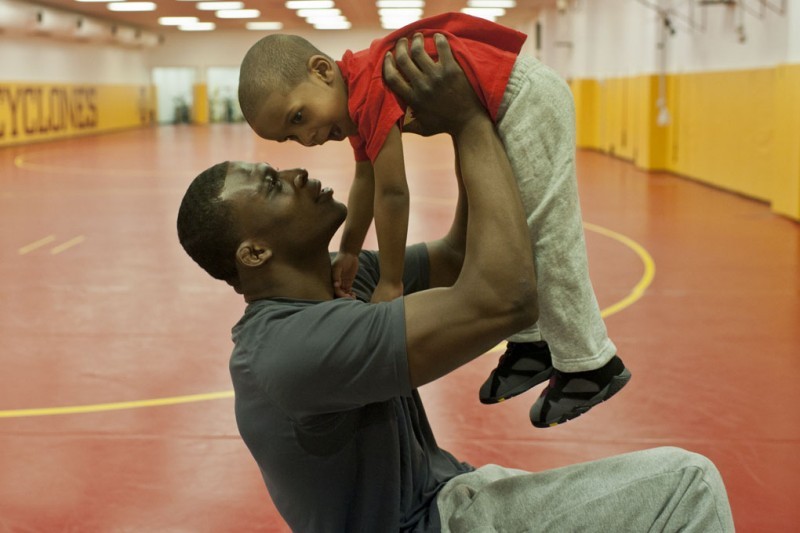 ISU wrestler Jerome Ward plays with his son, Jerome Trey Ward III.
