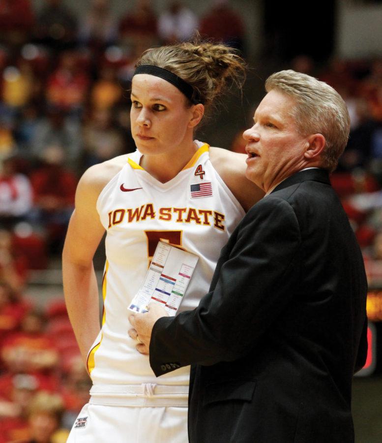ISU womens basketball coach Bill Fennelly speaks with sophomore forward Hallie Christofferson during the Cyclones game against the Kansas State Wildcats on Feb. 29, 2012 at Hilton Coliseum. Christofferson led the Cyclone effort with 14 points and eight rebounds. 