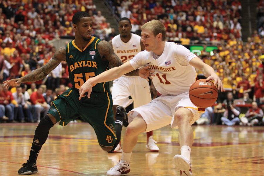 Senior guard Scott Christopherson makes a move toward the basket against Baylors Pierre Jackson during Iowa States 80-72 upset of ninth-ranked Baylor on Saturday at Hilton Coliseum. Along with his 23 points, Christopherson dished out five assists against the Bears.
