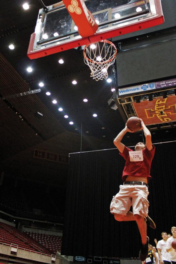 Kyle Martin, sophomore in physical education, rebounds his own shot during the Guinness World Record-setting largest game of knockout at Hilton Coliseum on Tuesday, April 17. Martin completed the shot, earning him a place in the next round.
