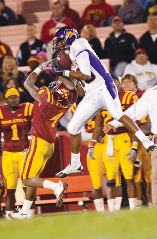 Defensive back Anthony Young attempts to intercept a pass thrown to a UNI receiver during Saturdays game against the Panthers. Young had nine tackles that assisted the Cyclones in getting a 27-0 victory over the Panthers.