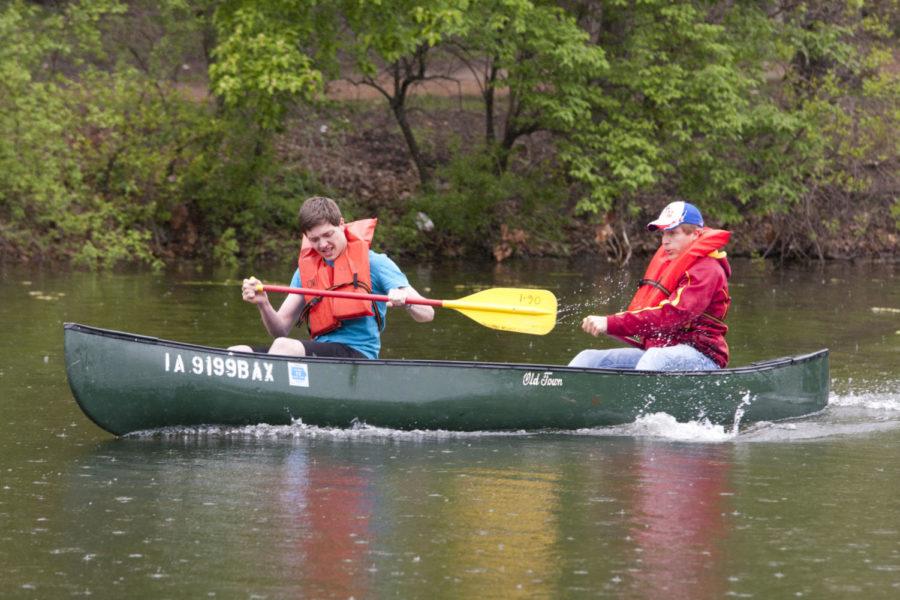 Ben Nosek, sophomore in mechanical engineering, and Clayton Burke, sophomore in civil engineering participate in the Veishea canoe races. The races were held at Lake LaVerne Saturday.

