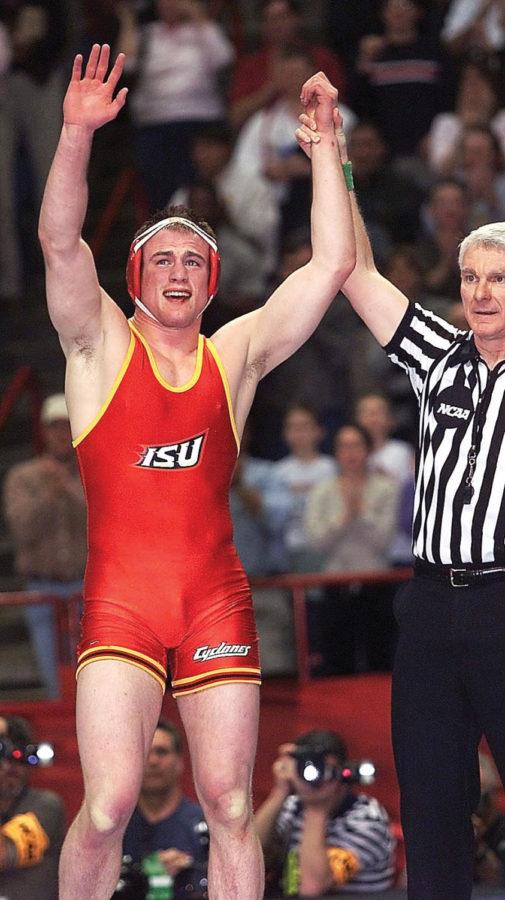 Cael+Sanderson%2C+ISU+%28197%29%2C+raises+his+hand+after+beating+Jon+Trenge%2C+Lehigh+%28197%29%2C+during+the+final+round+of+NCAA+National+Wrestling+session+held+in+Albany%2C+New+York%2C+Mar.+23%2C+2002.+