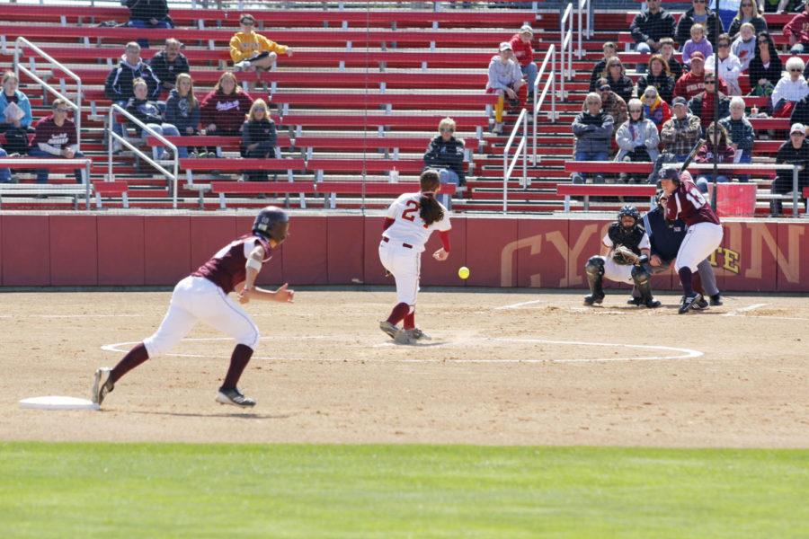 Pitcher Tori Torrescano pitches to Texas A&M opponent Meagan May while Natalie Villarreal looks to steal third during Firday afternoons double header against Texas A&M at the Southwest Athletic Complex. The Cyclones fell to the Aggies 1-6.
