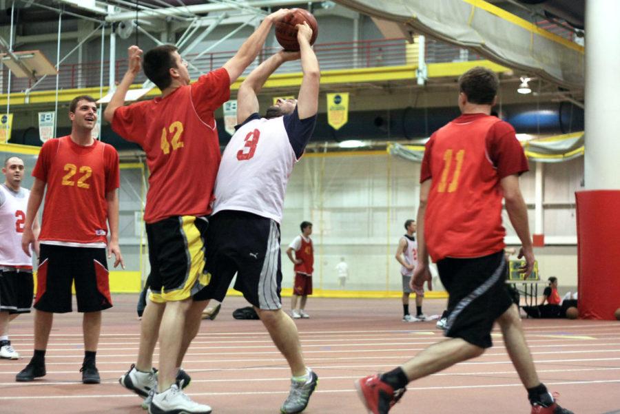 Mike Carter, senior in industrial engineering, defends against Ed Brewer, senior in logistics and supply chain management, during the 3-on-3 tournament for Veishea on Wednesday, April 18, 2012, at Lied Recreation.
