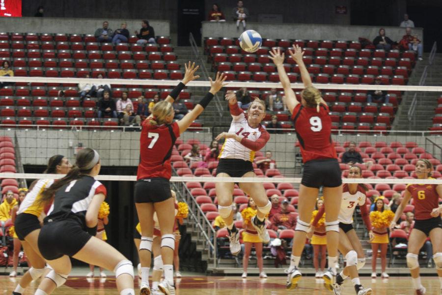 Outside hitter Jamie Straube spikes the ball against her opponents during the third set of the Iowa State — Nebraska spring game held Saturday evening at Hilton Coliseum. Straube gained the Cyclones 18 points, 31 total attacks and 15 kills in their 1-3 loss to the Huskers.
