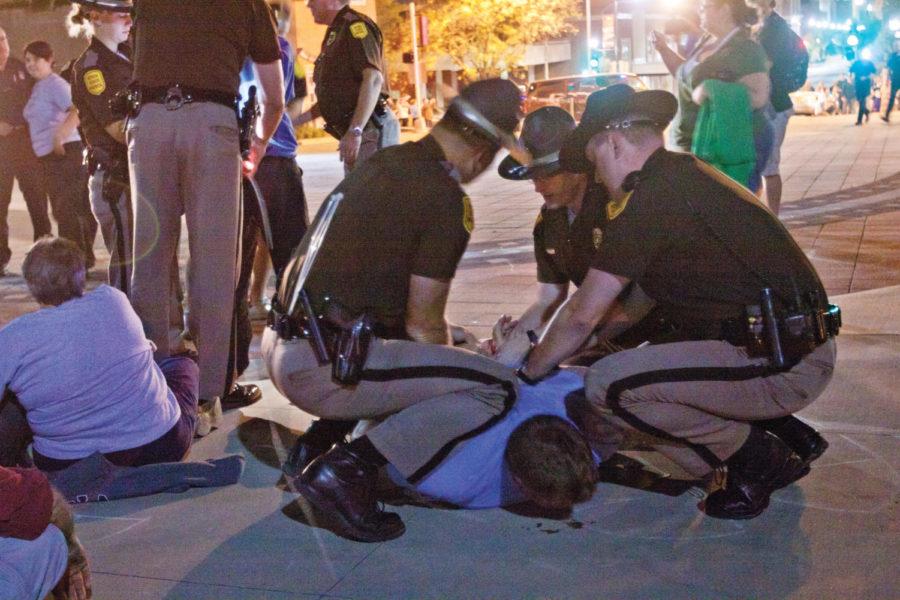 Members of the Iowa State Patrol begin to arrest Occupy Iowa
protesters on Oct. 9 after they refused to leave the State Capitol
complex at the 11 p.m. curfew. 32 people including two minors were
arrested on Sunday night.
