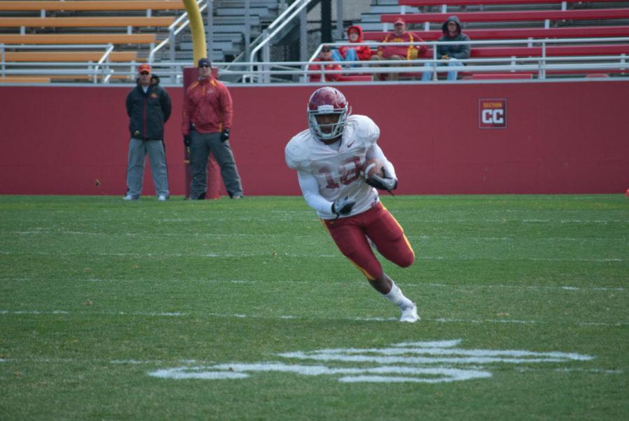 Sophomore Albert Gary catches the screen pass and makes a run down the sideline. The annual spring football game went on Saturday at Jack Trice Stadium. 