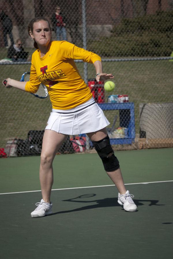 Cyclone Tessa Lang returns the ball Friday during a doubles match against Kansas at the Forker tennis courts. Lang and her teammate Maria Macedo lost 9-8 in a tiebreaker to Kansas doubles team Ekaterina Morozova and Dylan Windom.