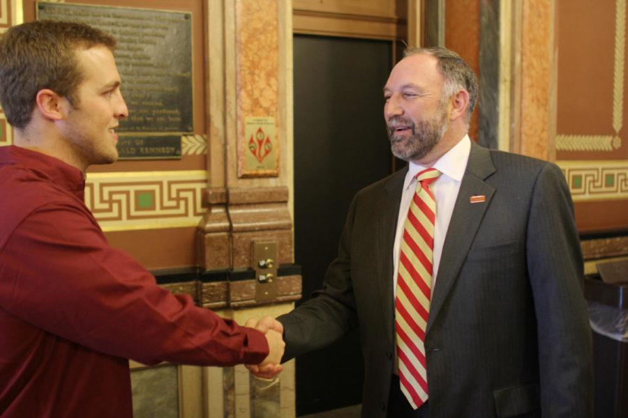 President Steven Leath talks hands with Stephen Veit, junior in political science, while at the Iowa Capitol for Regents Day. Leath made an appearance to represent all three presidents from Iowas public universities to express their pride in students who showed up.

