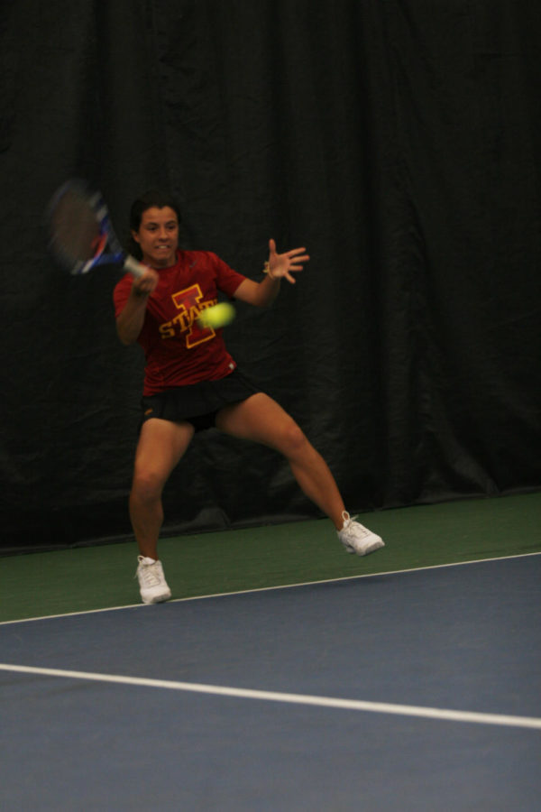 Photo: Sophomore Simona Cacciuttolo hits a forehand return shot against Texas. She would go winless on the day, however and Texas took home the 5-2 overall victory. David Merrrill/Iowa State Daily
