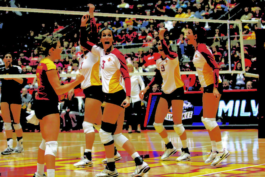 The team celebrates after scoring a point against UW-Milwaukee
on Friday, Dec. 2. Iowa State beat UW-Milwaukee in the first three
sets, advancing them to the next round.
