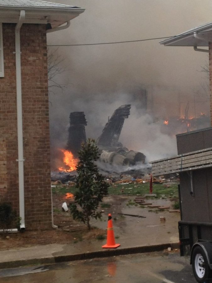 A Navy jet crashed Friday into some apartments near Virginia Beach, Va., sending flames and thick black smoke into the air, a military spokesman and a witness said.
