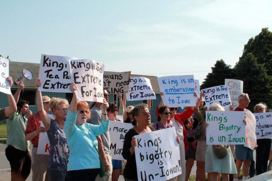 Protesters gather outside of U.S. Rep. Steve Kings new offices in Ames on Tuesday, May 23.
