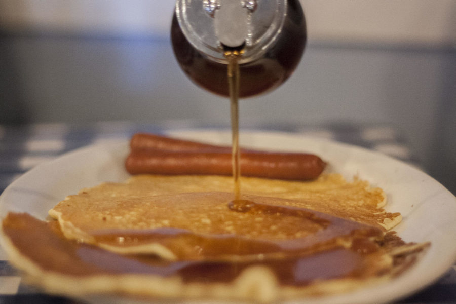 Syrup is poured over a plate of pancakes from the Ox Yoke Inn located in the Amana Colonies. The Ox Yoke Inn a well known stop for food in the Amana Colonies.
