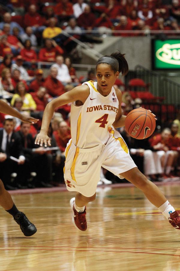 Guard Nikki Moody tries to move around the opposition during the
game against Texas on Saturday, Feb. 4. Moody scored six points and
had two rebounds in Iowa States win.
