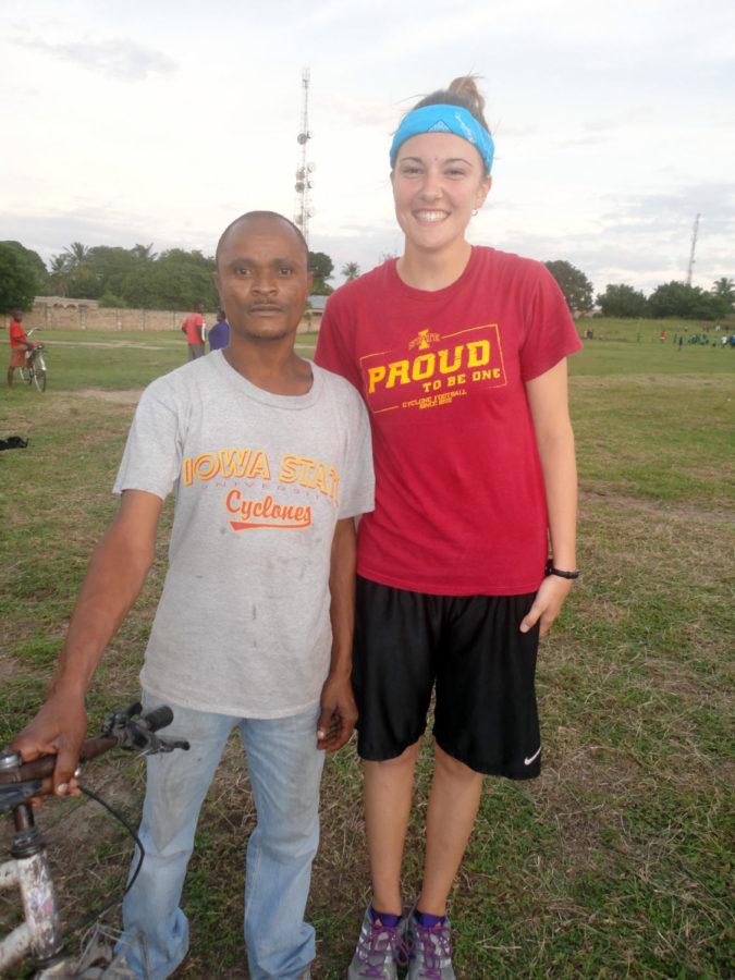 Amber Bruer stands next to a local wearing an ISU T-shirt for a picture in Tanzania, where she spent three weeks for the ROTC Cultural Understanding and Language Program.
