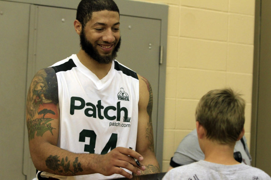 Royce White signs an autograph after the Capital City League game Wednesday, June 20, at Valley Southwoods High School in West Des Moines.
