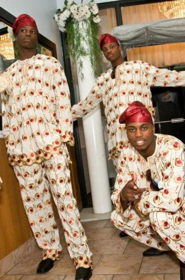 Ryan, left, Kenny and Melvin Ejim pose for a photo at the wedding reception for their mother, Elizabeth Omoghan.
