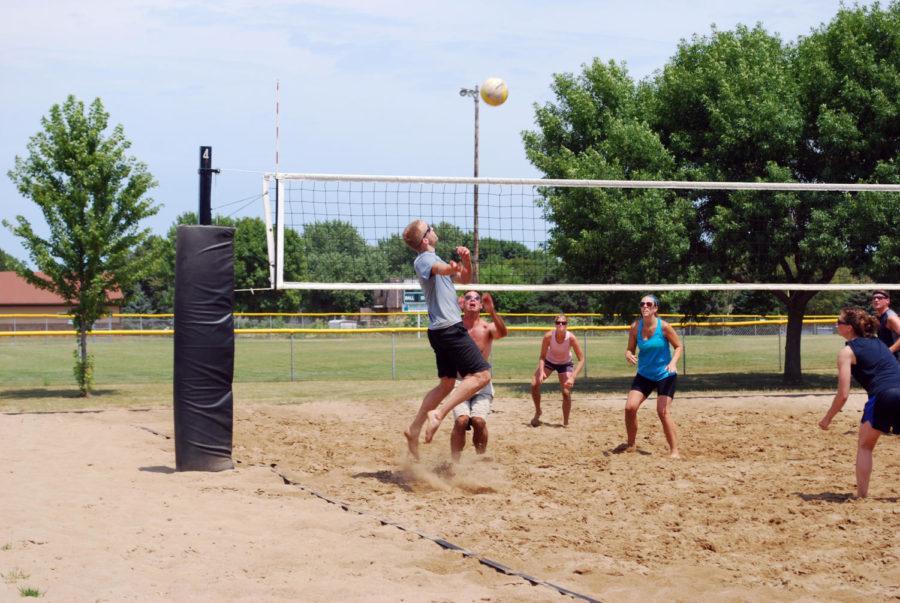 Kelly Schneider from Panther Spike jumps to control the ball. 2012 Iowa Games, Sand Volleyball was played in Ankeny on Saturday, July 21st. Photo: Jack Heintz/Iowa State Daily
