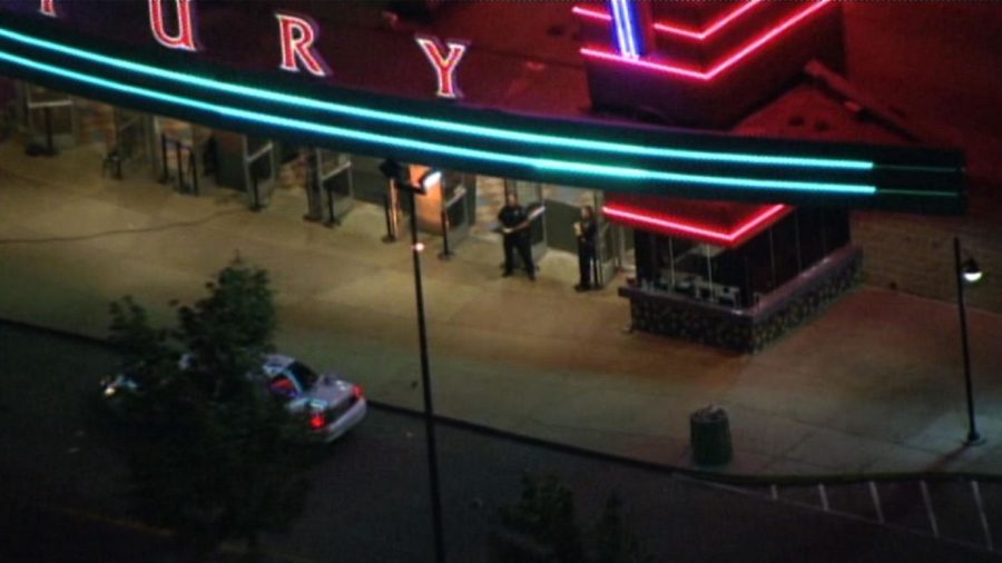 A+gunman+opened+fire+at+the+Century+16+movie+theater+in+Aurora%2C+Colo.+killing+at+least+12+people+and+injuring+50.+The+suspected+gunman+is+in+custody.%0A